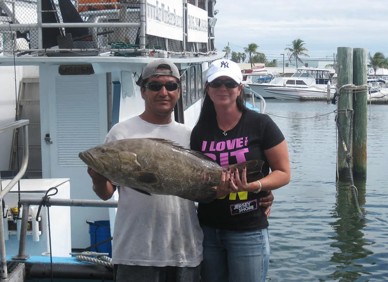 Captain Jamie Snediker with grouper catch Key West Florida
